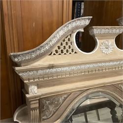 Late 19th century pine and gesso mirror back or wall mirror, pierced broken swan neck pediment decorated with foliate and central flower head motif, shield shaped bevelled mirror, the spandrels decorated with scrolled foliate decoration, two tier shelves on turned and fluted supports  - THIS LOT IS TO BE COLLECTED BY APPOINTMENT FROM THE OLD BUFFER DEPOT, MELBOURNE PLACE, SOWERBY, THIRSK, YO7 1QY