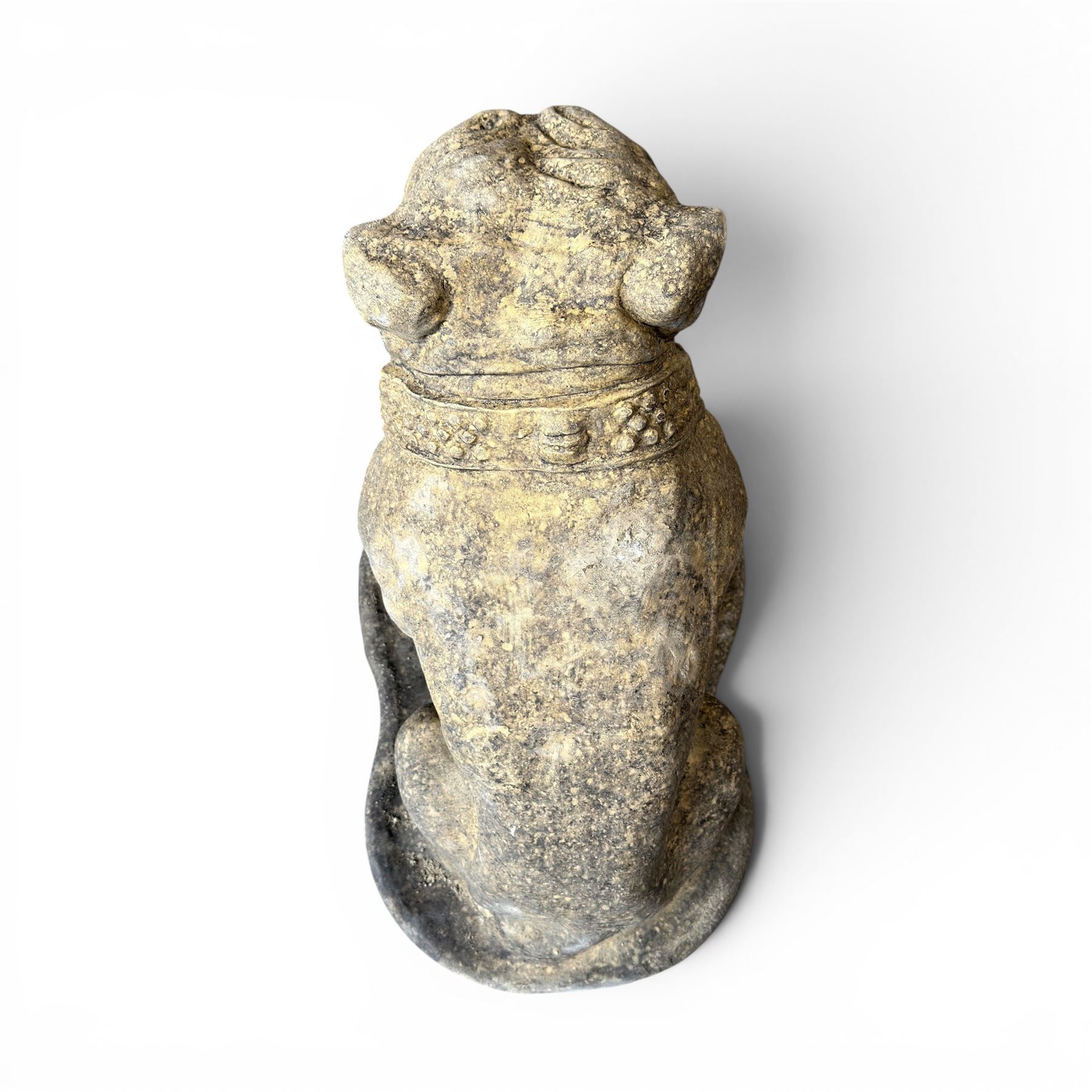 Cast stone garden statue on the form of a seated British bulldog with studded collar on a shaped rectangular base