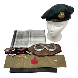 WW1 British Army Derby Scheme 1915 Attested armband; beret with East Yorkshire cap badge; pair of fur lined leather flying/motorcycle goggles; HMS Pembroke cap band; and small quantity of RNAS cloth and metal badges etc