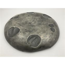 Liberty & Co Tudric pewter Bollelin tray, designed by Archibald Knox, of circular form with shaped edge, cast in relief with foliate tendrils surrounding a green enamel cartouche, impressed beneath Made by Library & Co English Pewter 044, D25.5cm