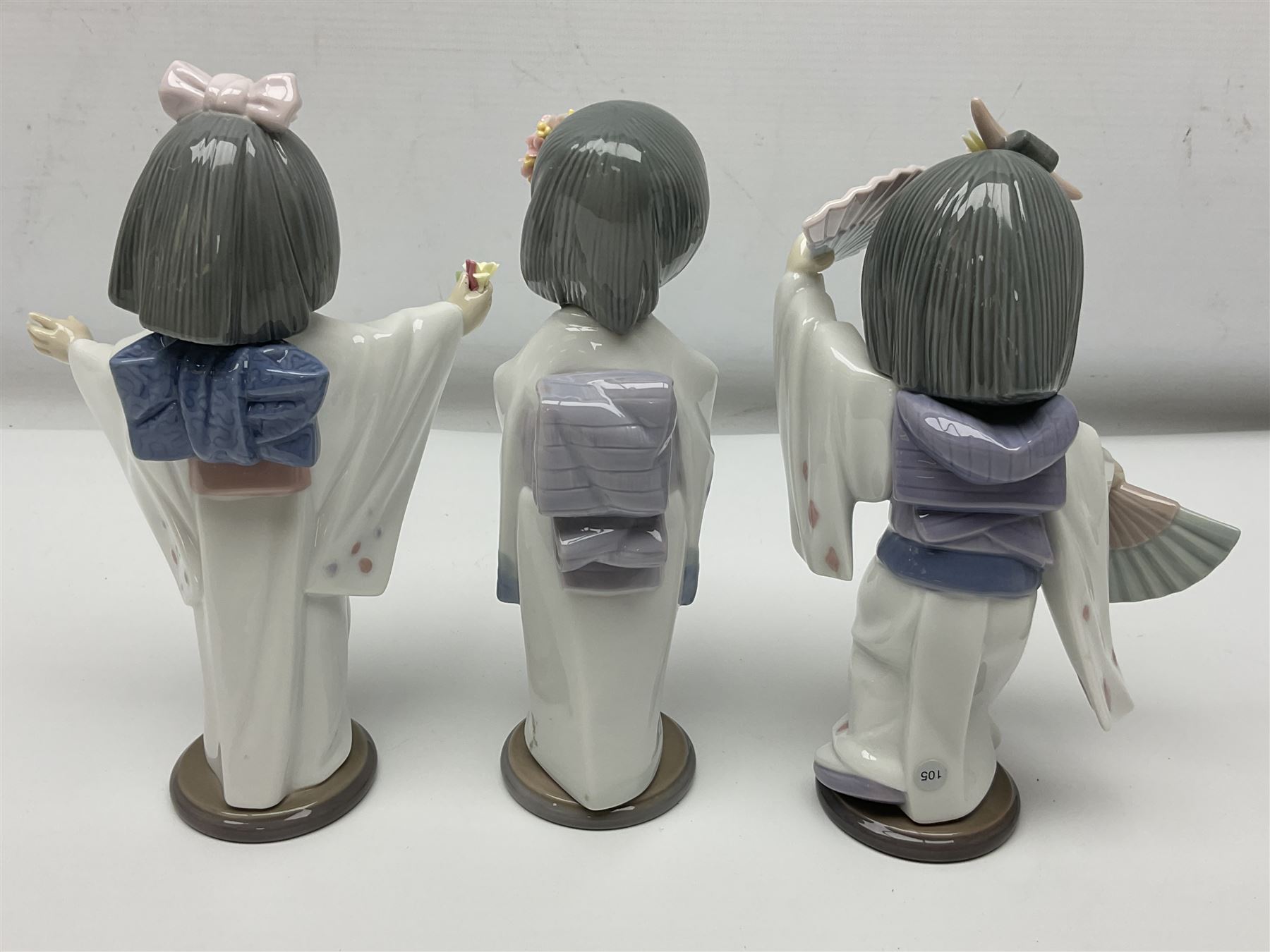 Six Lladro figures of the China doll set and Oriental doll set, comprising Playing the Flute no.6150, Bearing Flowers no.6151, Flower Gazer no. 6152, Oriental Dance no. 6230, Oriental Lantern no. 6231 and Oriental Beauty no. 6232, largest H20cm