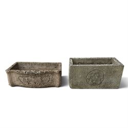 Two weathered composite stone garden trough planters, comprising a low serpentine trough r...