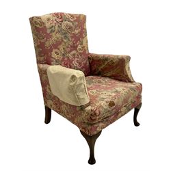 Early 20th century beech framed upholstered wing back armchair 