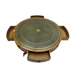 Georgian style yew wood drum table, circular top with green and tooled leather inset, fitted with four drawers, on turned pedestal base with four splayed supports, brass cups and castors