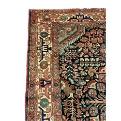 Persian Malayer rug, the field decorated with tree of life, floral, animal and bird motifs, surrounded by three band border with geometric design