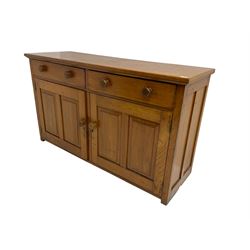 JAS Brister & Co Ld - Mid-20th century teak sideboard, fitted with two drawers over two panelled cupboards, stamped 'JAS. Brister & Co Ltd., Complete House Furniture, Port Elizabeth'