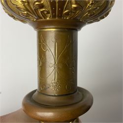 20th century gilt metal monstrance, in the Gothic revival style, with glazed aperture to centre surrounded with clear paste stones, in a pierced floral and scroll border set with coloured paste stones, within a sunburst surround, on a paste set knopped stem and similar foliate foot, H59.3cm