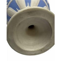 Victorian Parian ware twin handled vase detailed with Bacus masks fruiting vines and floral sprays H36cm, together with a Parian jug H14.5cm, classical Parian sculpture H40cm, decorative plaque decorated in high relief depicting two children D18.5cm. 