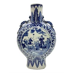 19th century Chinese blue and white moon flask vase, the central panel depicting musicians, bordered by floral, foliate and scroll decoration, with lizard handles to each shoulder, upon an oval foot, H31cm 