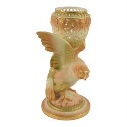 Royal Worcester Blush Ivory, comprising reticulated pot pourri jar upon eagle support, with black printed mark beneath, twin handled posy vase, shape no. 1556 with pink fluted body and puce mark beneath and three jugs, including shape no. 1018 example with bird mounted handle and two shape 1094 examples, all decorated with floral sprigs and with puce marks beneath, tallest H21cmn