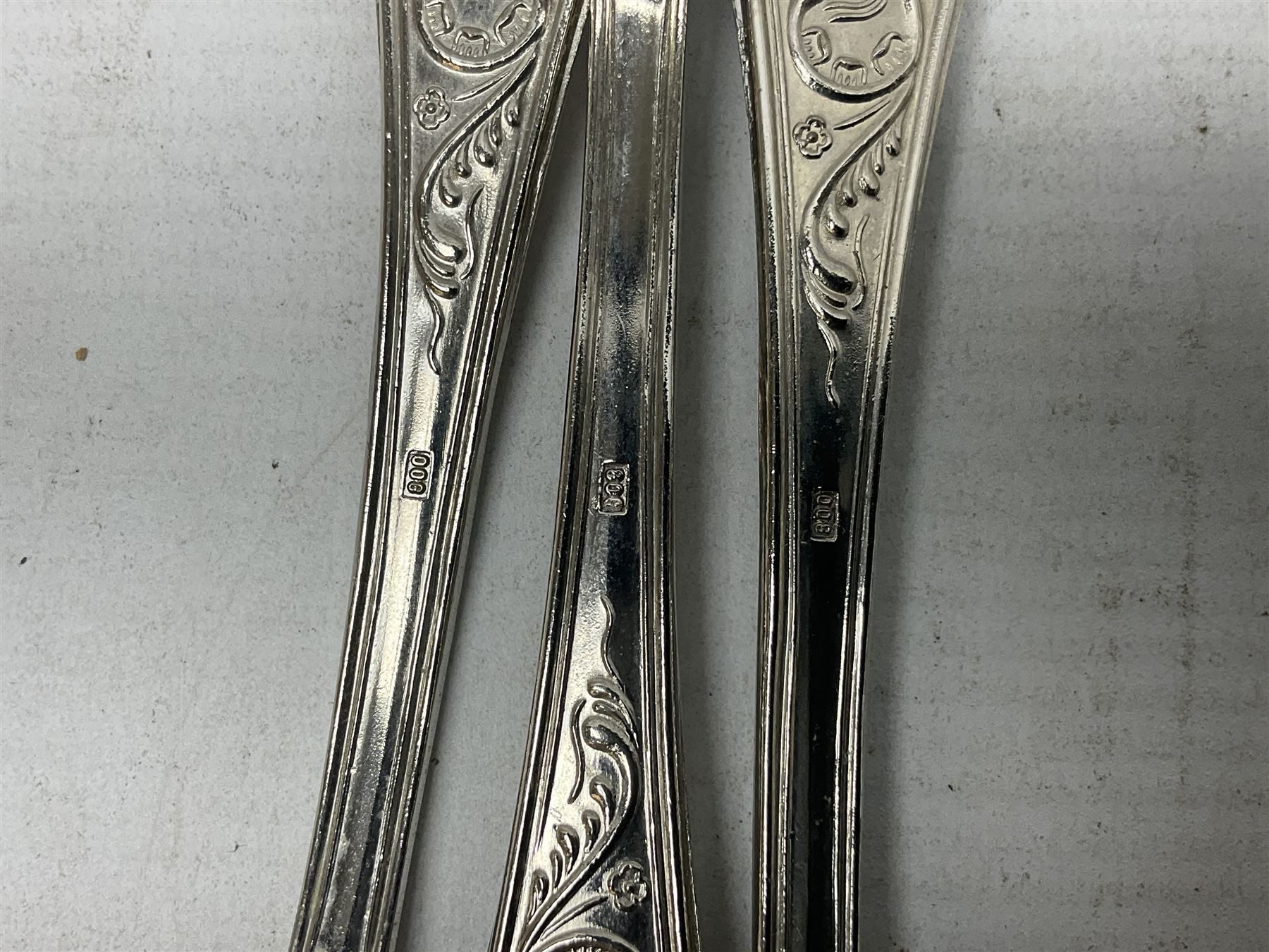 White metal flatware, comprising three table spoons, and ten teaspoons, marked 800, approximate weight 289 grams