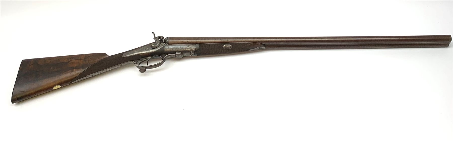 19th century James Woodward 64 St. James's Street London 12-bore side-by-side double barrel hammer shotgun with screw under lever opening and patent action, walnut stock with chequered grip and 76cm damascus barrels, No.3186, L117cm overall SHOTGUN CERTIFICATE REQUIRED
