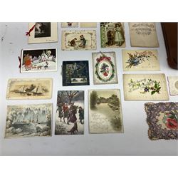 Quantity of Victorian and later postcards and greeting cards, to include Valentine's cards, paper laced, cut card work, chromolithograph and moveable examples, together with photographic examples and silk bookmarks, housed in a case