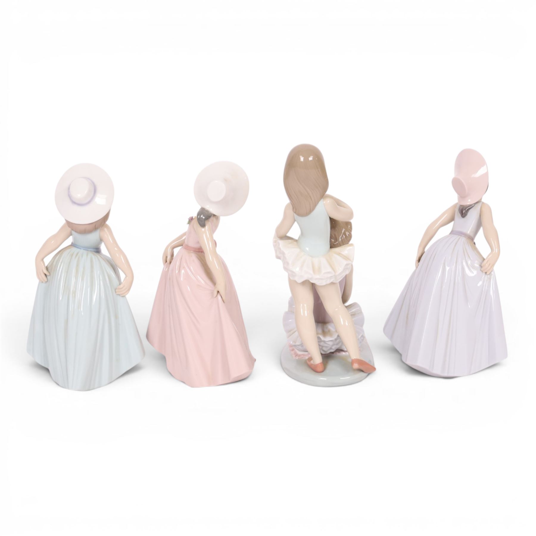 Four Lladro figurers, comprising First Ballet 5714, Iris 6276, Rose 6275 and Daisy 6274, all boxed 