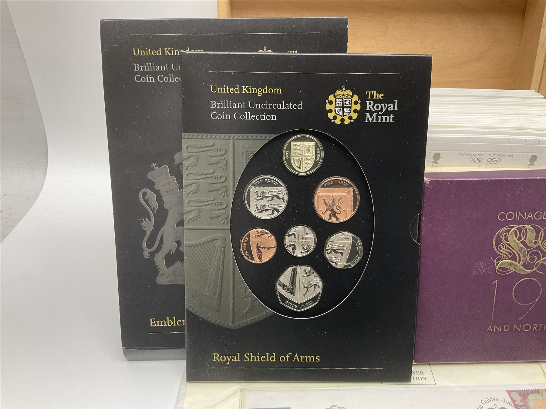 Coins and stamps, including The Royal Mint Great Britain 1970 coin set in plastic holder, 2006 'Brunel' coin cover containing two commemorative two pound coins, Alderney 2006 sterling silver proof five pounds, two 2007 five pound coins in card folders, two limited edition mint first class stamp sheets each comprised of ten first class stamps, various first day covers many with special postmarks housed in 'Royal Mail' boxes etc