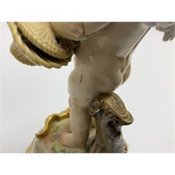 Late 19th/early 20th century Meissen figure of cupid, modelled standing with empty quiver across back, holding a basket in one arm, the other raised to head, upon a naturalistically modelled base detailed with gilt bow,  and marble effect socle base with gilt bands, with blue crossed swords mark beneath, H18.5cm