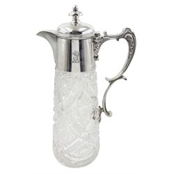 Edwardian silver mounted cut glass claret jug, the glass body of tapering form cut with star and diamond pattern, with silver collar supporting a cast scrolling handle and hinged domed cover, hallmarked Walker & Hall, Sheffield 1907, H30cm