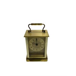 Battery driven marble mantel clock in the Art Deco style and a brass finished carriage clock. Both with quartz movements