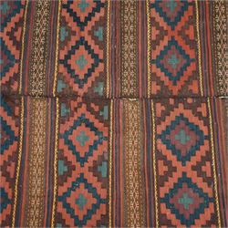 Group of four late 20th century wool kilim rugs, comprising a narrow tribal runner with stylised tree motifs and hooked guard bands (H 180cm, W 56cm), a lozenge medallion rug with decorative striped ends (H 125cm, W 75cm), a red and blue kilim with trefoil repeat field and multicoloured border bands (H 187cm, W 98cm), and a wide horizontal striped example with alternating lozenge and linear motif rows (H 260cm, W 173cm)