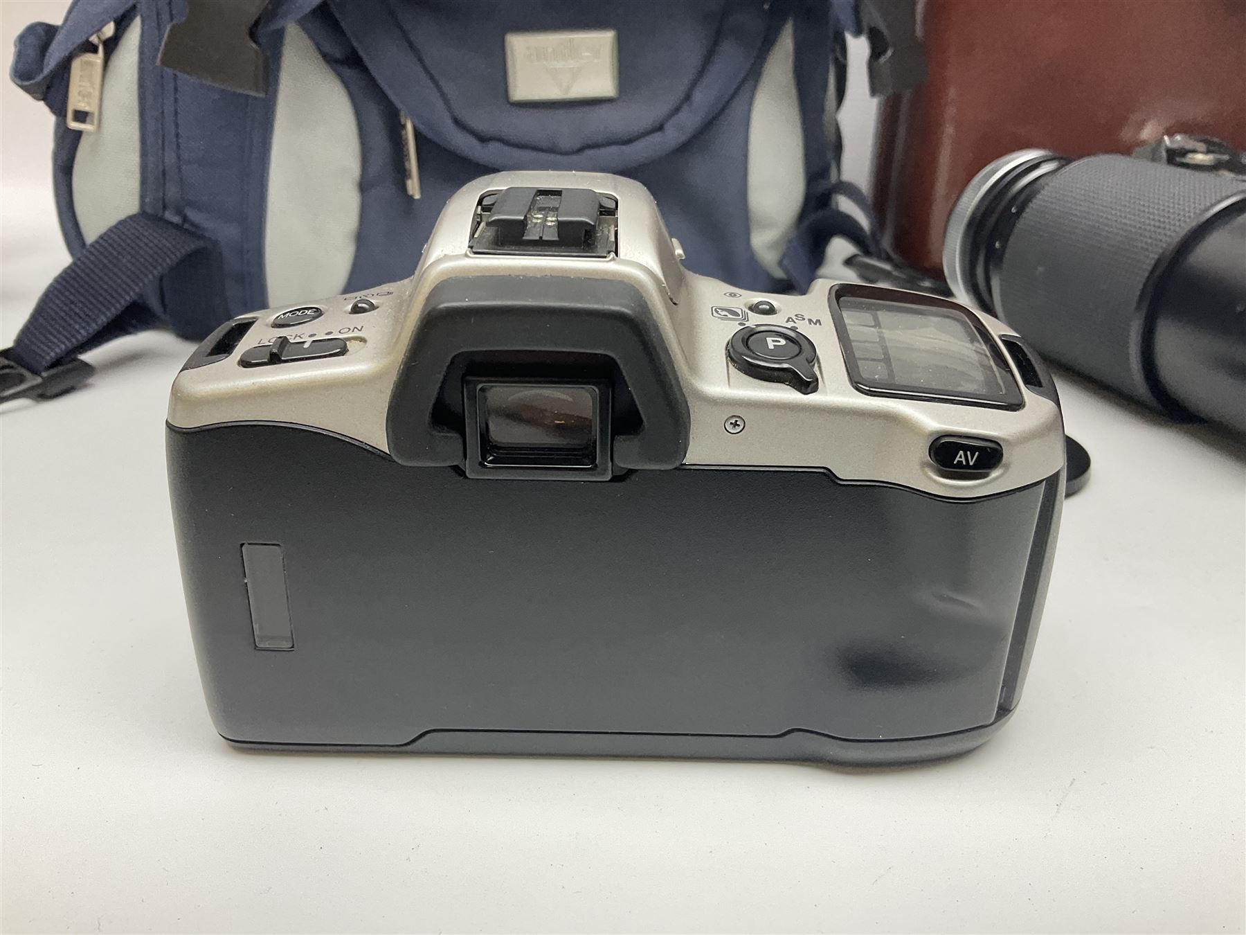 Four Minolta camera bodies, to include Dynax 500si, serial no. 94812651 with 'Signa Zoom 1;3.5-4.5 f=28-70mm' lens, Maxxum 300si, serial no. 97821665, with 'Tamron AF 80-210mm' lens and Dynax 300si, serial no 01603265'  with Minolta AF Power Zoom 35-80mm 1;4' lens, etc, together with Pantax MV1 camera bodies and other camera equipment 