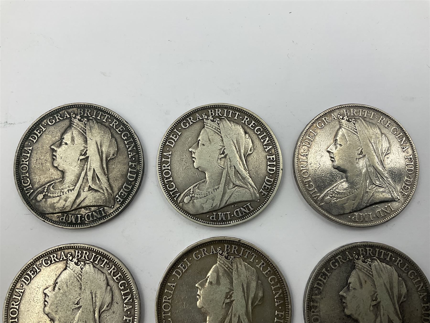 Six Queen Victoria silver crown coins, dated 1893, two 1896, 1898, 1899 and 1900