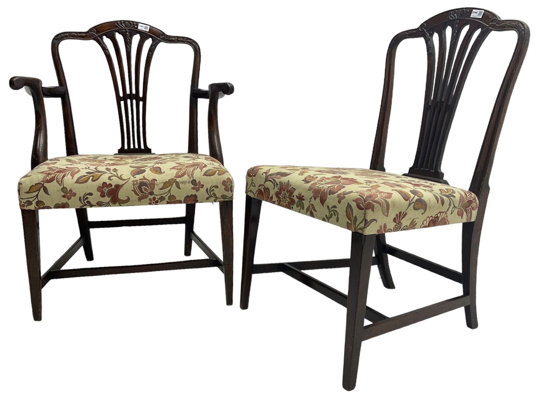 George III Hepplewhite design mahogany elbow chair and matching side chair, cresting rail carved with bellflowers over pierced and flared splat, seats upholstered in floral patterned fabric, raised on square tapering supports united by stretchers