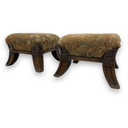 Pair of early 20th century miniature footstools, square seat covered in gold and orange floral patterned tapestry fabric, on carved wooden frame with splayed supports 