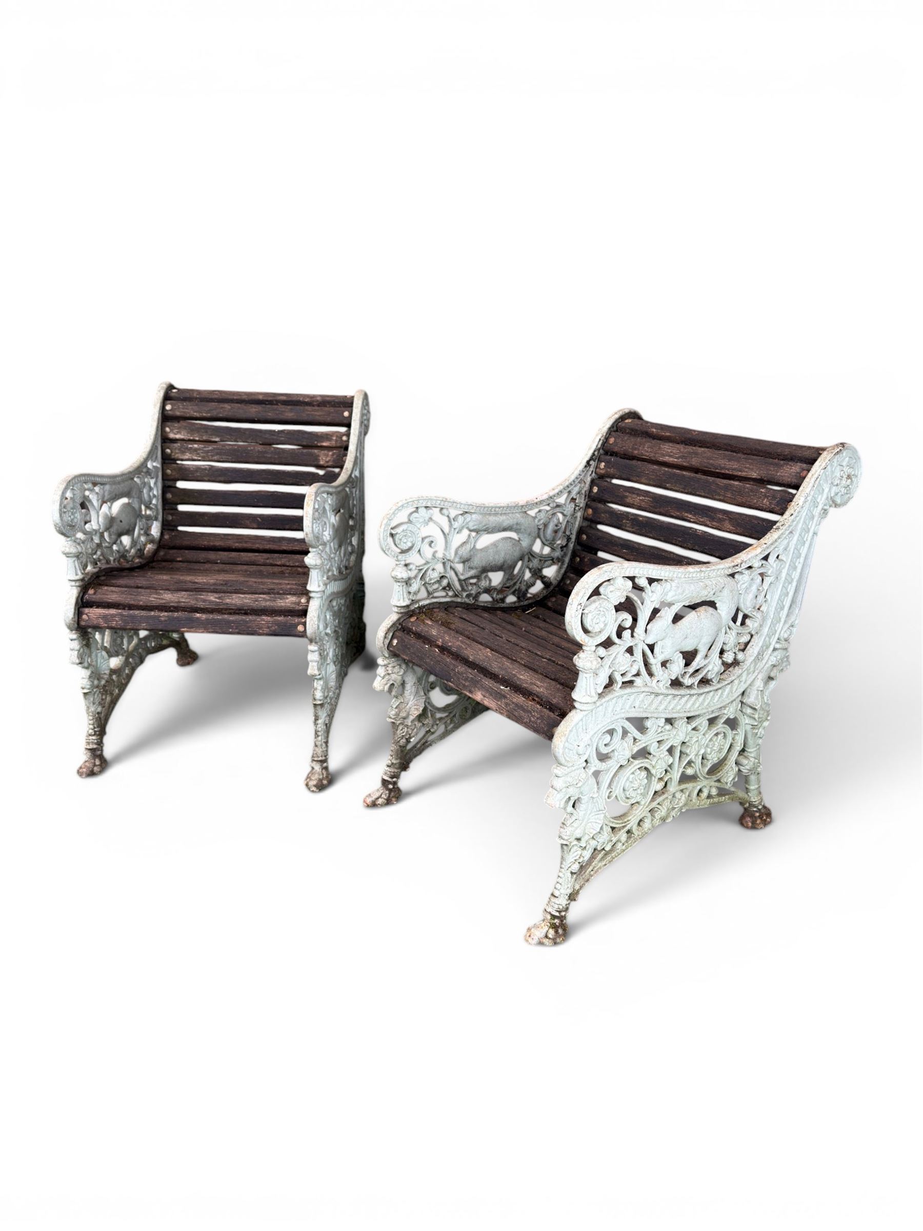 Pair of unusual Victorian revival heavy cast iron garden chair benches, ornate scrollwork detail with squirrels and nature, serpentine wood slatted seat and back - design by George Smith at the Sun Foundry, Glasgow