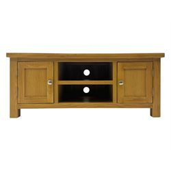 Contemporary oak television stand, rectangular top over two central open compartments, flanked by panelled cupboard doors enclosing additional shelves, raised on stile supports