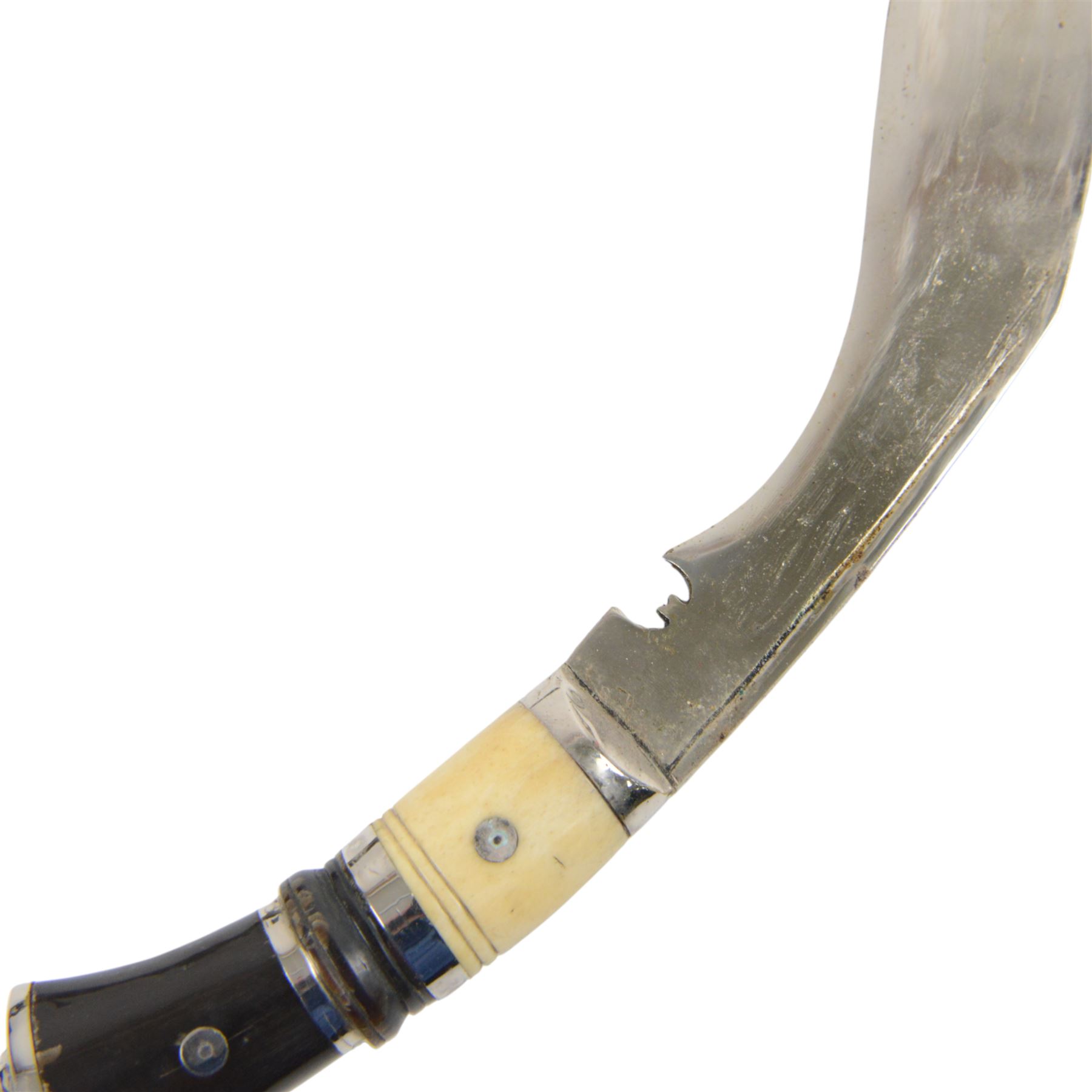 Pair of kukri knives, with with ebonised and bone handles, with two smaller knives, with a leather scabbard with floral silvered decoration, L44cm