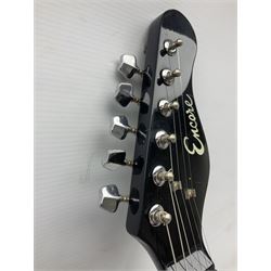 Encore black electric cut-away guitar L96cm; and Spanish Victor Garcia model 187 acoustic guitar, bears label dated 1972 L99cm; each in soft carrying case (2)