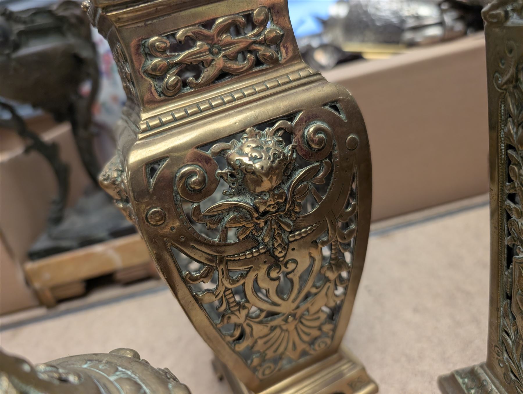 Brass twin handled planter, pair of pierced brass bottle neck vases and three other brass vases