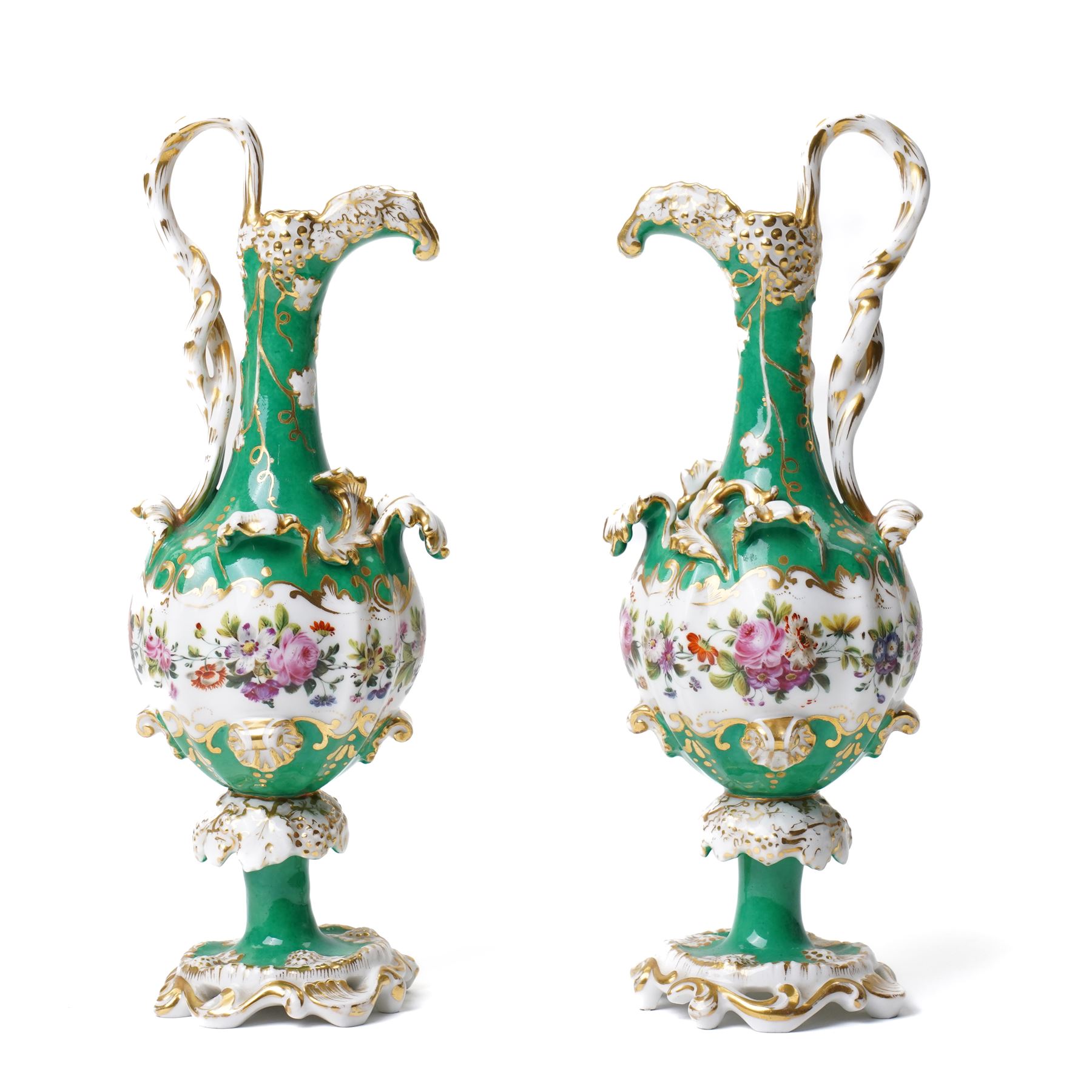 Pair of mid-19th century Jacob Petit ewers, in the Rococo Revival style, hand-painted with panels of flowers on a green ground and heightened profusely with gilt, JP mark in underglaze blue to base, H25cm