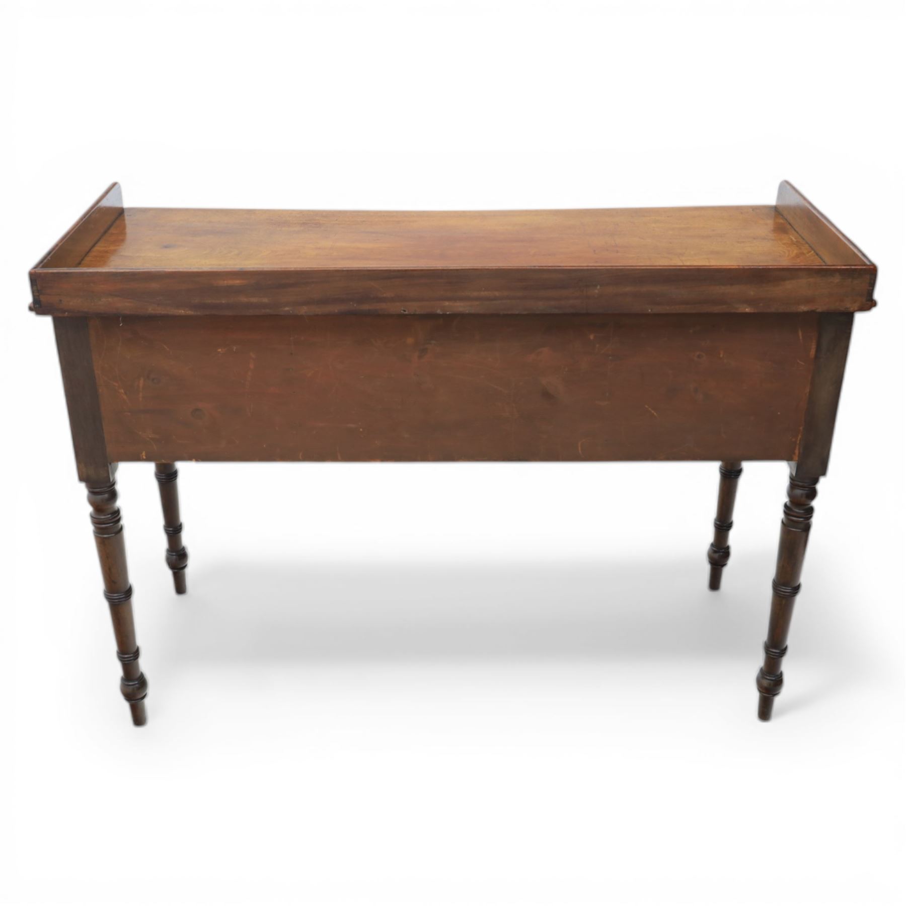 Late Georgian mahogany sideboard, circa 1820, the rectangular top with gallery, above an arrangement of four drawers with brass ring handles, one double height drawer to the left, a central single frieze drawer, and two drawers to the right, upon turned legs