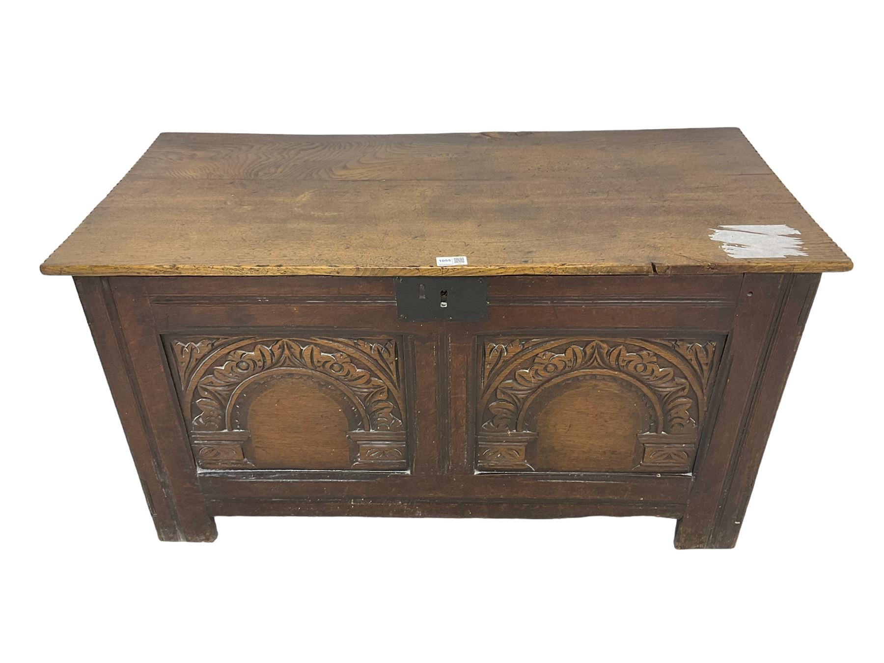 Jacobean Revival - 19th century oak blanket chest, rectangular hinged top, the two front panels carved arched foliate decoration, raised on stile supports