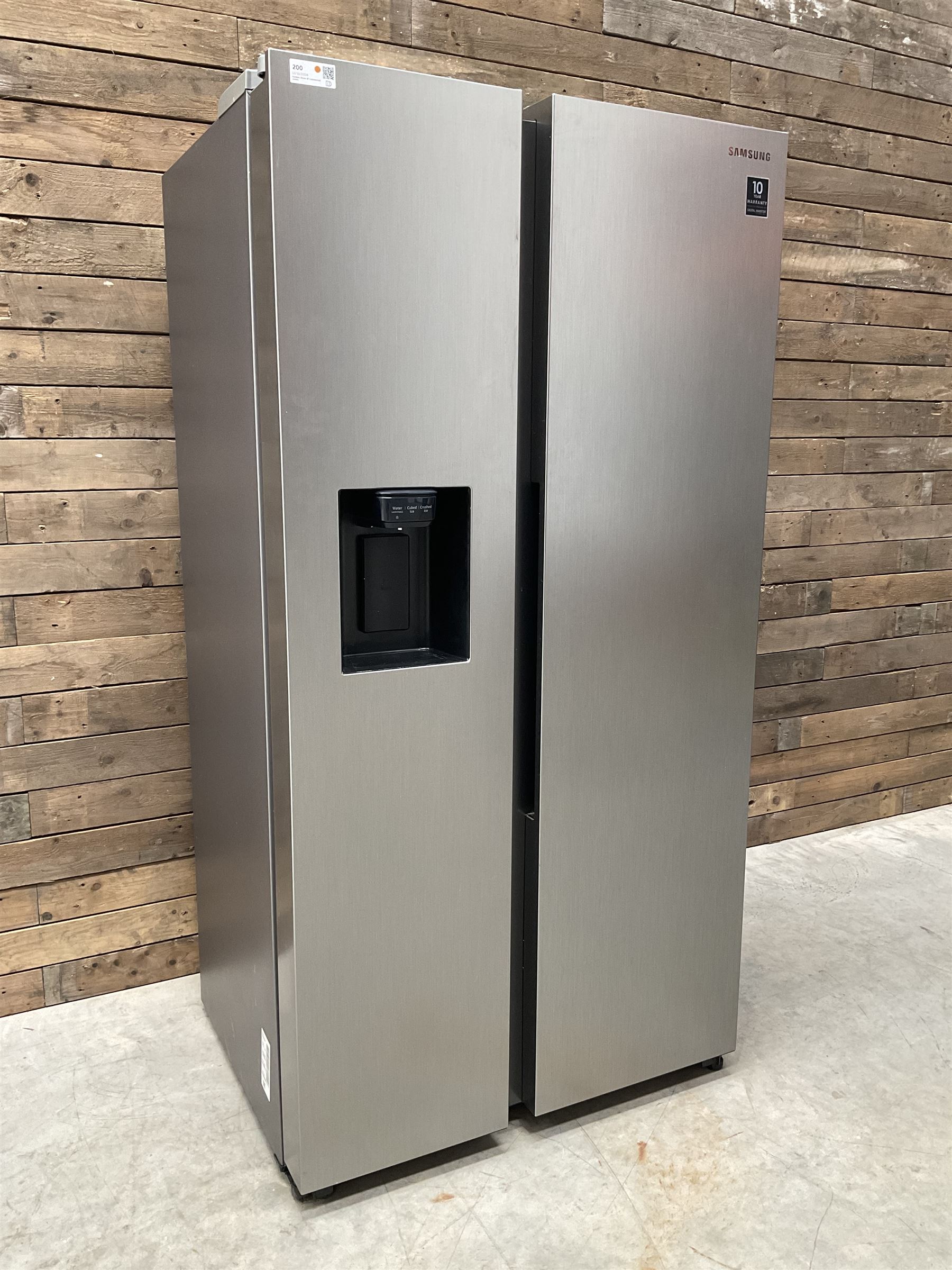 Samsung RS68N8320S9 American style side by side fridge freezer, non plumbed ice and water dispenser. Serial no. 05NT4EBN800405K, August 2020.