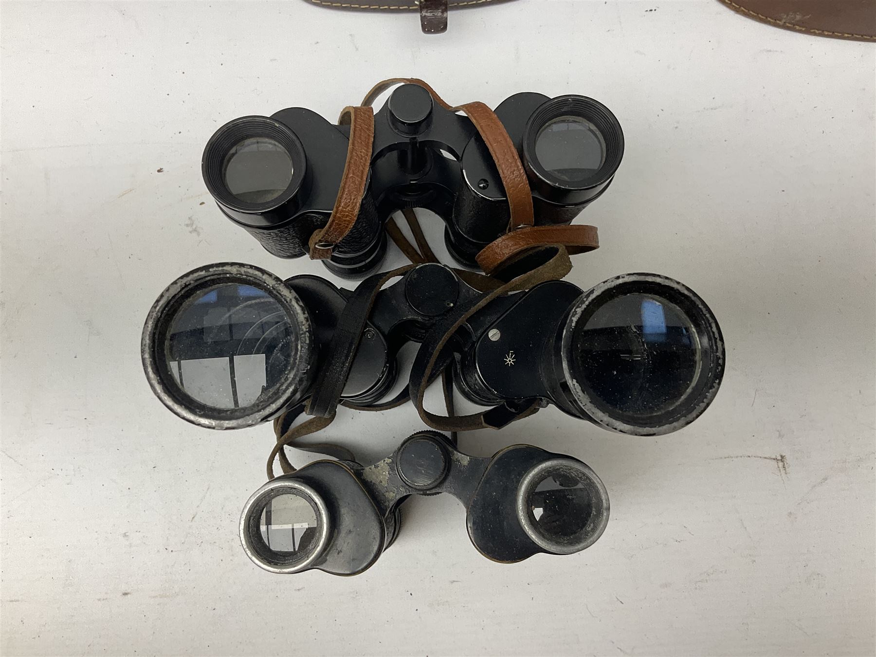 Eight cased pairs of binoculars, to include Zenith 10x50 field binoculars, Prinz 16x50, Prinzlux 10x50, Aquilus 10x35, etc, and a further binocular case