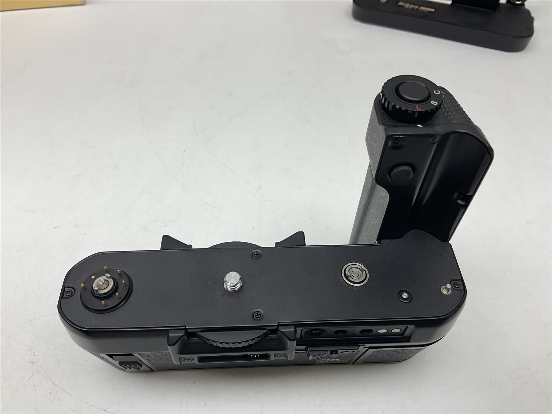 Nikon F3T camera body, in champagne/ titanium colourway, serial no. T8215031, with 'Nikon Nikkor 50mm 1:1.4' lens, Nikon MD4 motor drive, serial no. 156592 and Nikon MK-1 Firing range converter, all with original boxes 