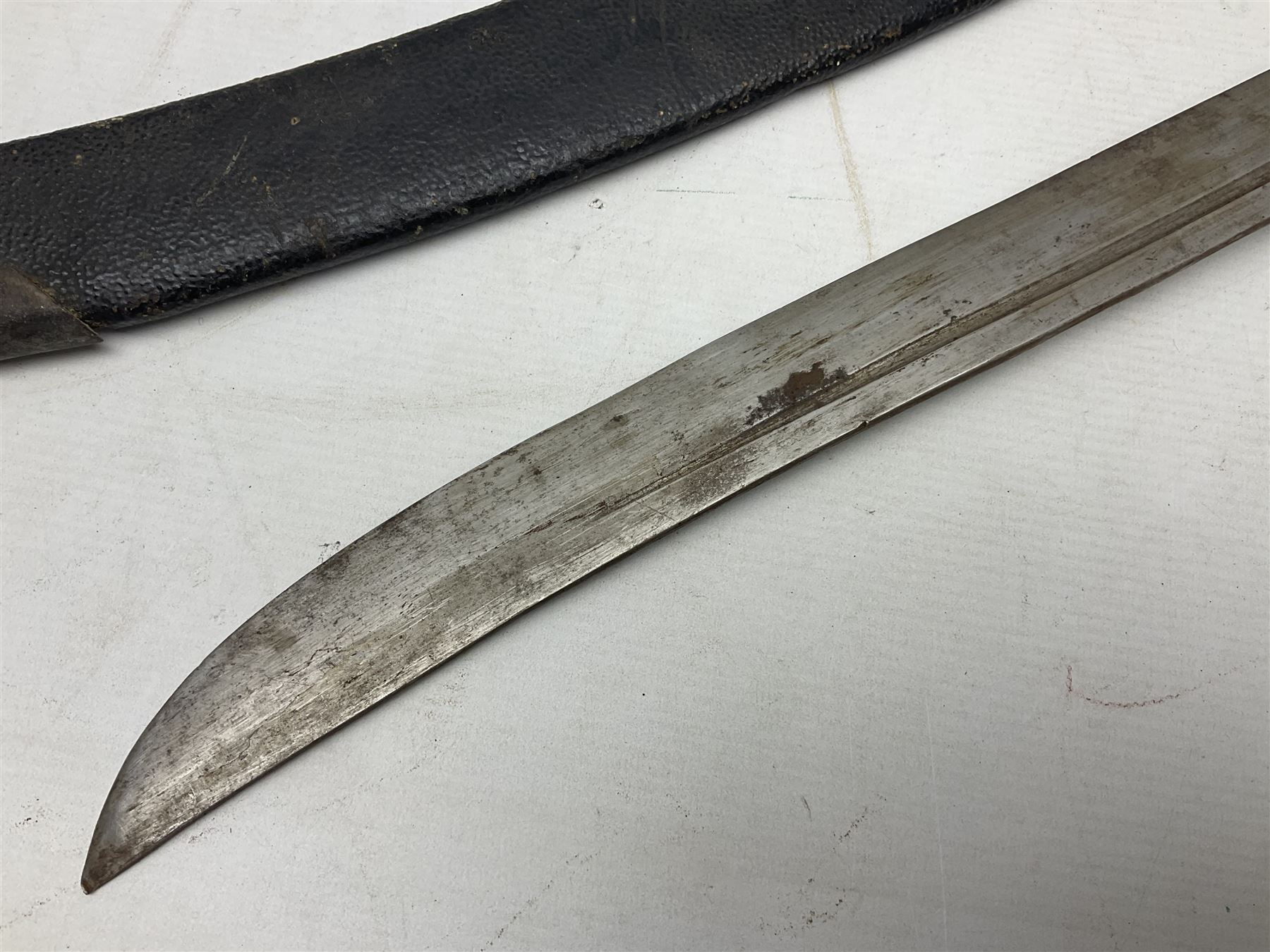 Chinese Boxer Rebellion Period Sword, 69.5cm heavy curved single edge blade with single narrow fuller, plain iron dished circular guard, iron pommel and ferrule with plaited cord bound grip; in skin covered wooden scabbard with iron chape and long suspension mount L95cm overall