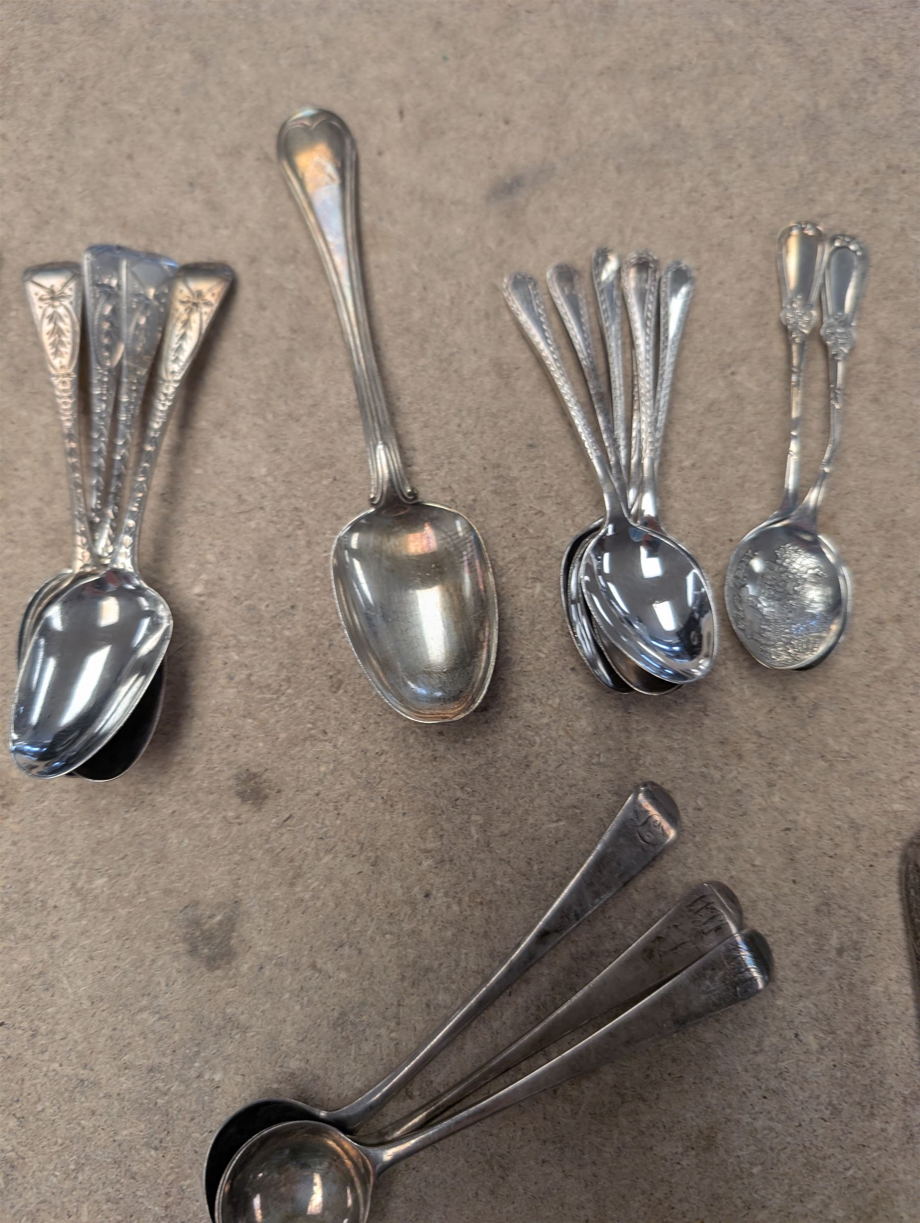 Collection of silver teaspoons, including souvenir and American silver examples, together with a silver handled fork and a mother of pearl handled silver knife, all stamped or hallmarked 