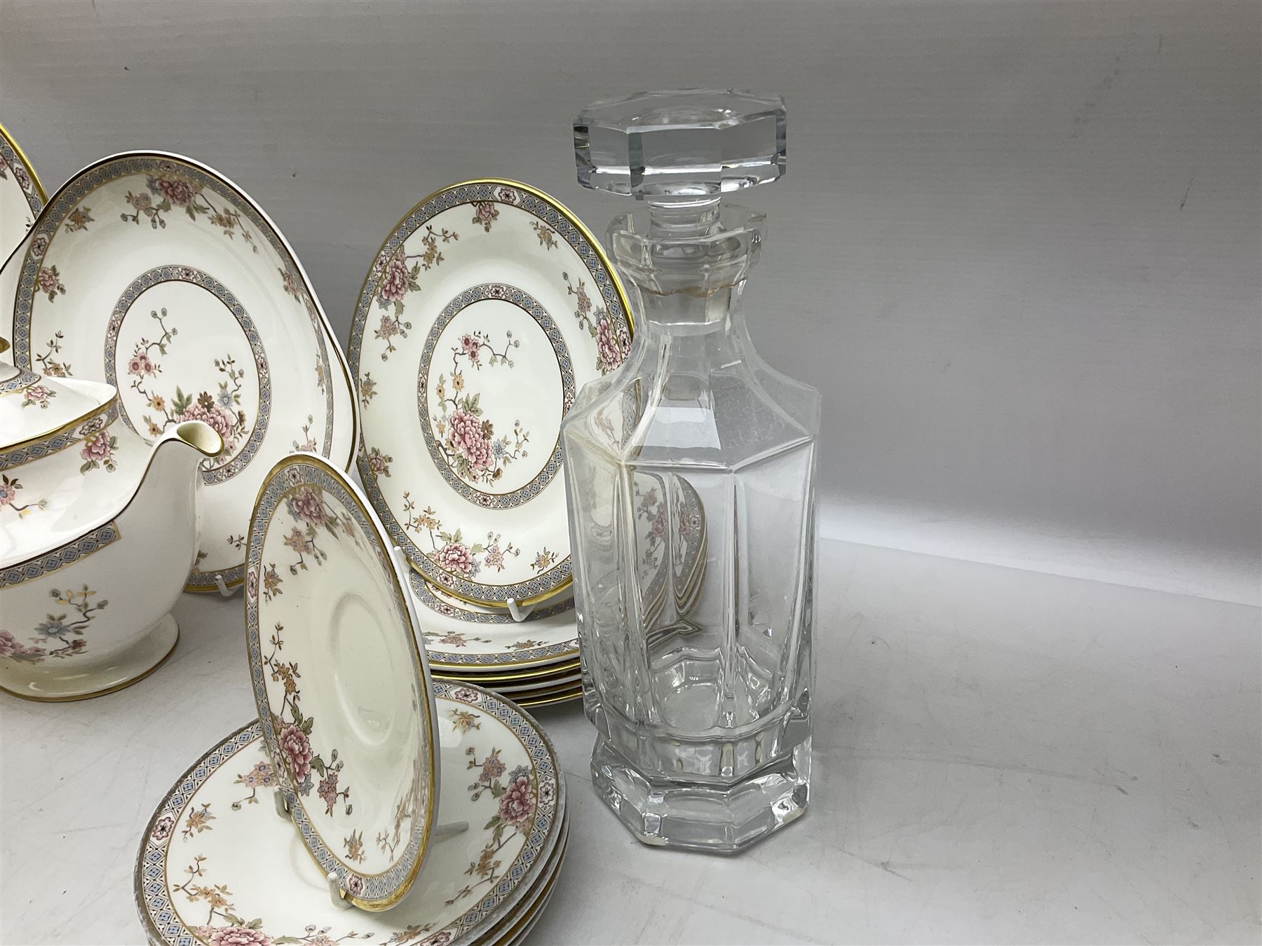 Royal Doulton Canton pattern tea and dinner wares comprising teapot, milk jug, twin handled lidded sucrier, cake plate, six dinner plates, six side plates, five smaller plates, five saucers and pair of candlestick holders, together with Sevres clear glass decanter with faceted sides and stopper, all with marks beneath