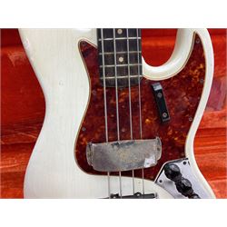 1963 Fender Jazz three-knob bass guitar; impressed with date code 7AUG63A on end of neck and serial no.L08587 on back plate; all original but re-finished in white in the 1970s; sold with photographs of the instrument in the 1960s with original finish and in the 1970s re-finished; L117.5cm; in original hard carrying case; Provenance: the professional guitar of Howard Livett from new to his death in 2005. Howard played in The Humperdincks, the backing group for Englebert Humperdinck, also played in the backing group for Max Bygraves and in the band Hedgehoppers Anonymous. The guitar is also sold with a manuscript letter of provenance from Howard's wife.