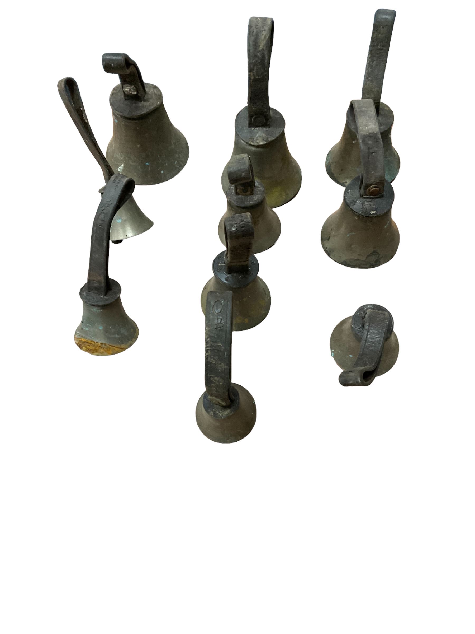 Collection of 44 late 19th century brass church/musical handbells with leather straps by James Shaw Brothers of Bradford and bells marked G.W. possibly cast by the George Welch bell foundry, London.
The number of bells and stated notation, some at different pitch, is as follows;
5 “C”, 4 “D”, 5 “E”, 4 “F”, 5 “G”, 5 “A”, 6 “B”.
3 “F#”, 4 “C#”,1 “Db”, 1 “G#”, 1”A#”.
Two of the bells are minus their clappers and one bell has no leather strap.
