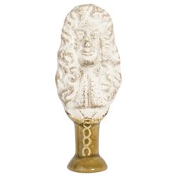 Mid 19th century biscuit porcelain pipe tamper depicting King Charles II, with glazed lowe...