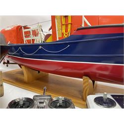 Two remote controlled kit-built plastic model boats - RNLB Sheerness Lifeboat Helen Turnbull L92cm and 'Conserver' Grangemouth L76cm; each on wooden stand; together with three remote control units