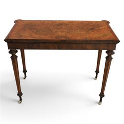 Victorian walnut card table, hinged rectangular moulded top with rounded corners and figured veneers, revealing a green baized lined interior, plain frieze with beaded lower edge, raised on ring turned tapering supports terminating in ceramic castors