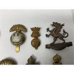 Fourteen cap badges of Irish interest including Royal Dublin Fusiliers inscribed to the slider 'From A. O'Connor 2nd Batt. Dec.2nd 1915', Connaught Rangers, South irish Horse Yeomanry, Inniskilling Fusiliers, Royal Irish Regiment etc; and seven Welsh badges including South Wales Borderers, Welsh Guards, 3rd Bn. Monmouthshire Regt. etc (21)
