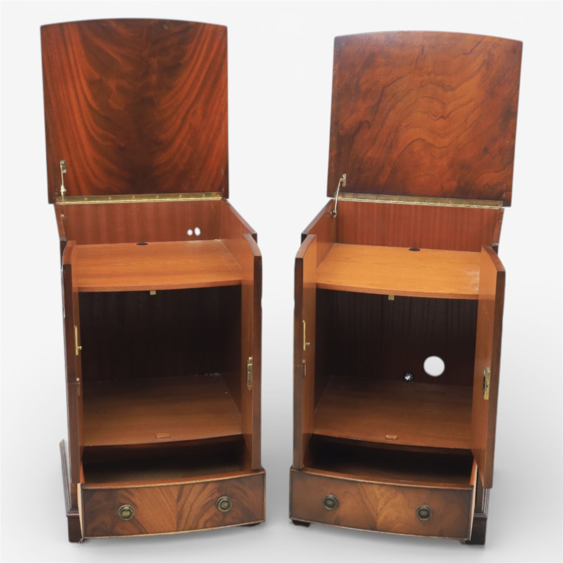 Reprodux - Georgian design pair of mahogany bow-front cabinets, moulded lifting hinged top, above a locking cabinet with drawer below, raised on bracket feet 