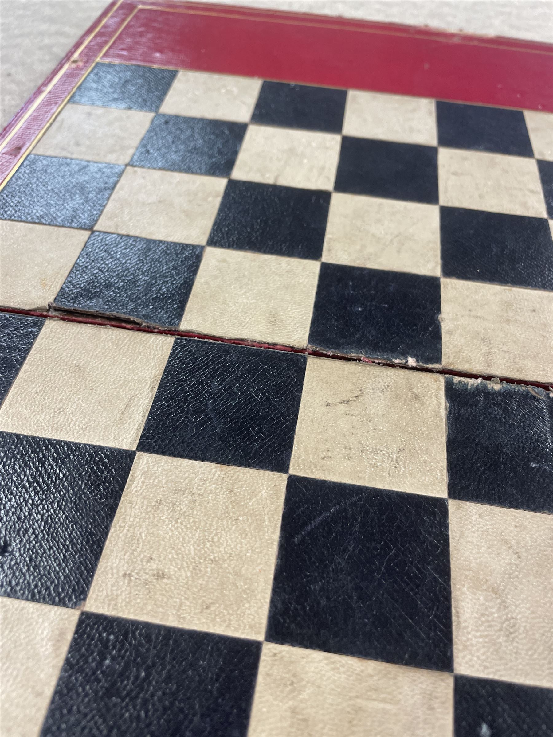 19th century walnut and brass bound games compendium box, painted to enhance the grain, of rectangular form, the hinged opening cover with rounded sides, central brass cartouche with engraved lion crest, and brass riveted straps, opening to reveal a red leather and blue silk lined compartmented interior, with fold-down games board, and lift-out tray containing playing cards, ebony turned dice towers, white and red stained bone draughts, and chess pieces, ivory dice, and ivory and ebony whist markers, and brass bezique board, cribbage board and markers, H15cm W32cm D24cm
This lot has been registered for sale under Section 10 of the APHA Ivory Act