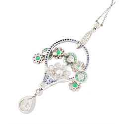 Art Deco platinum milgrain set diamond, emerald and sapphire flower basket pendant necklace, the basket set with old cut diamonds, calibre cut sapphires and emeralds, diamonds approx 2.00 carat, suspending a single pear cut diamond of approx 2.05 carat, on a platinum trace link chain necklace, stamped Plat, circa 1915-1920, in fitted box by Licht & Morrison, London